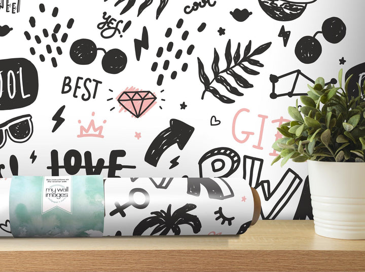 a white vase with a plant and a black and white wallpaper