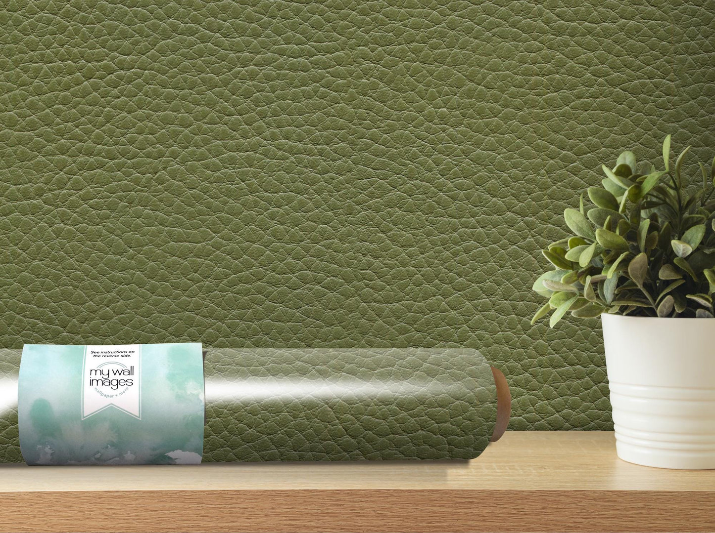 a vase with a plant on top of a table