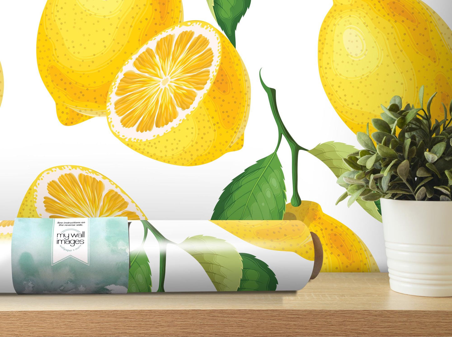a vase with a plant next to a wallpaper with lemons on it