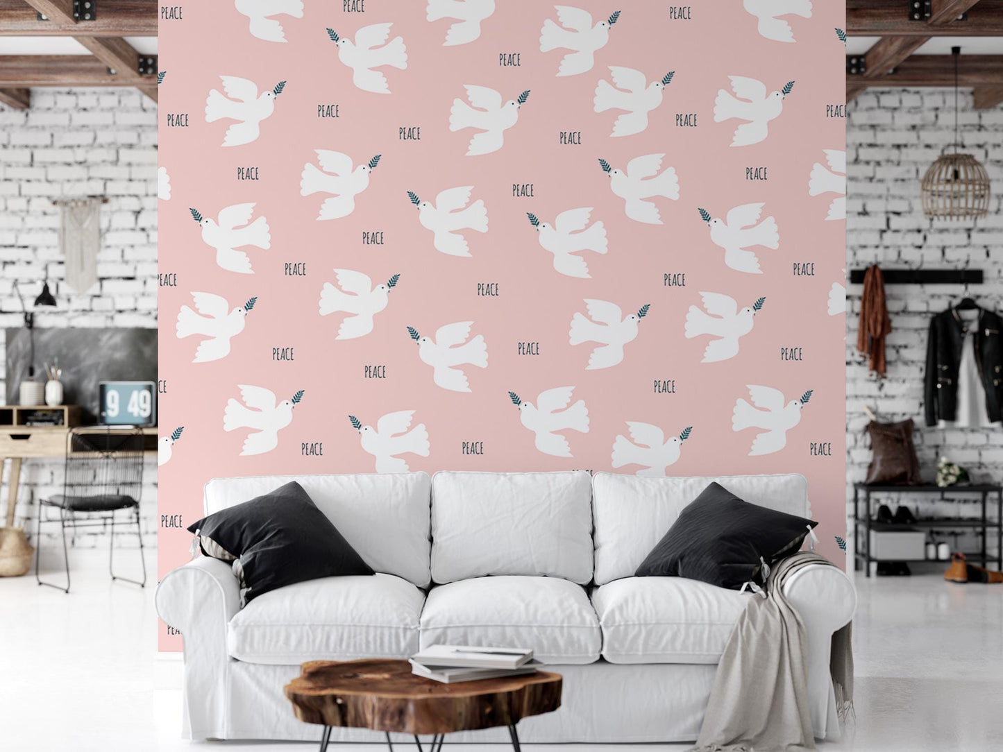 a living room with a white couch and a pink wall