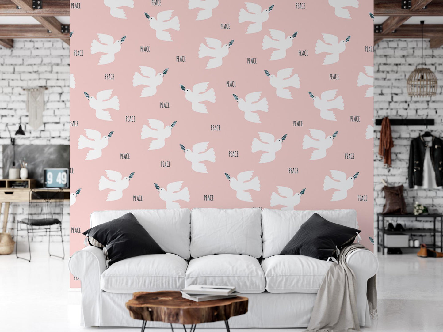 a living room with a white couch and a pink wall