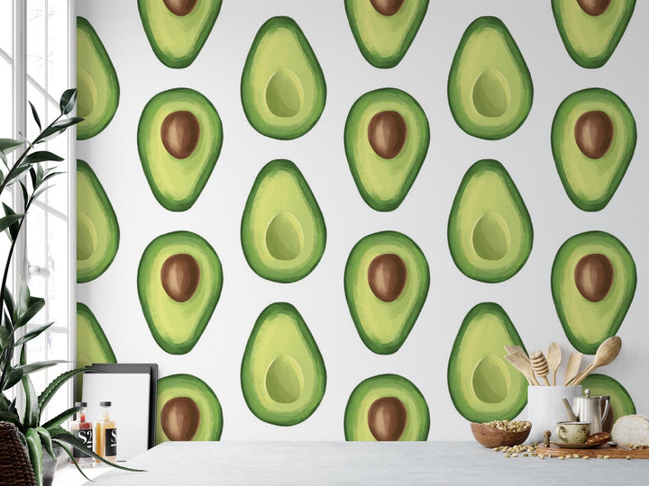 an avocado pattern on a wall next to a potted plant