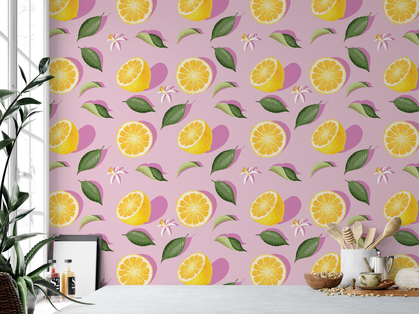 a pink wall with lemons and leaves on it