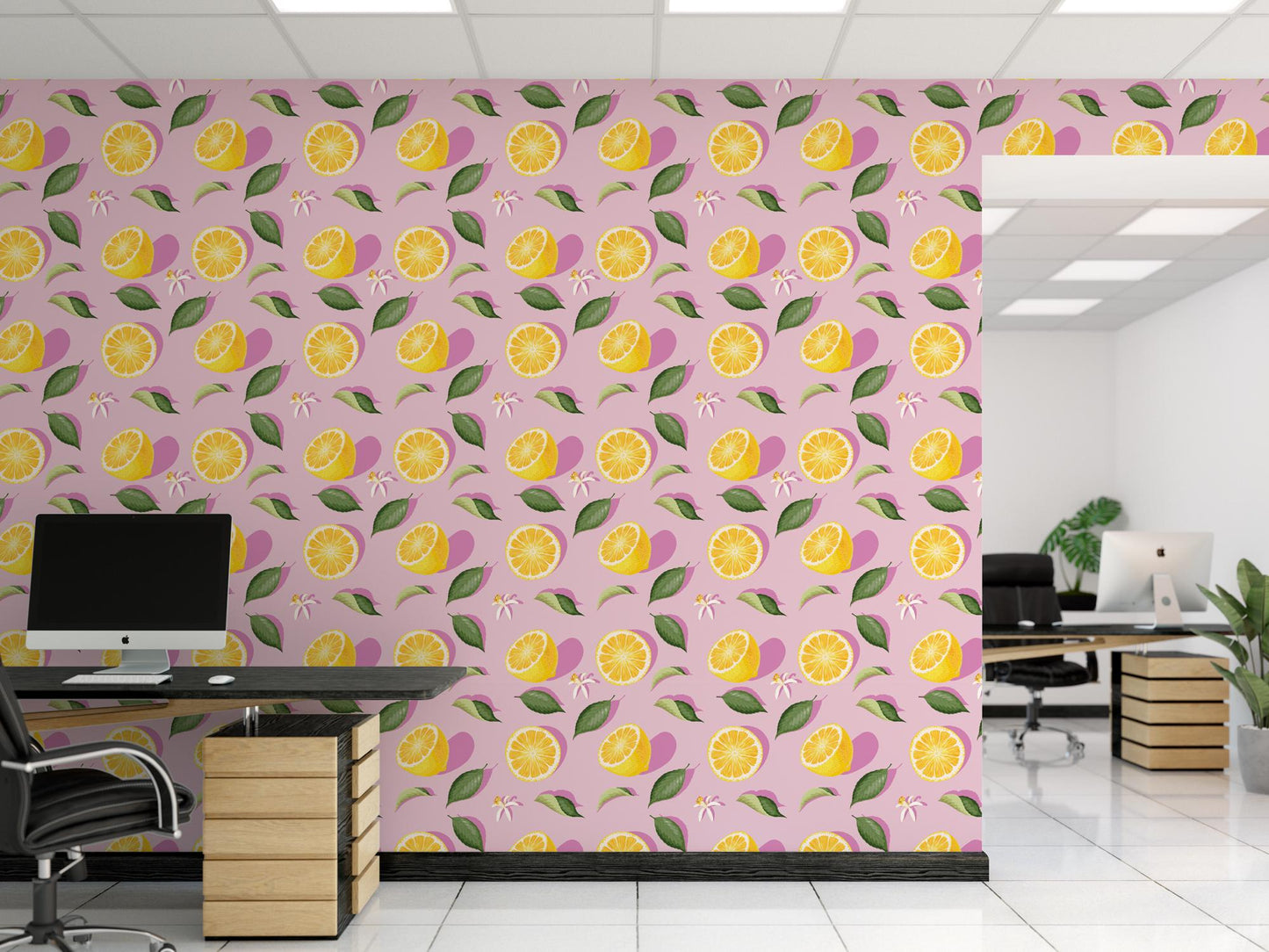 an office with a pink wall with yellow lemons on it