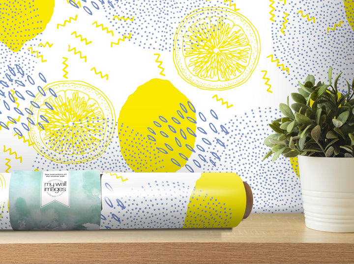 a yellow and blue wallpaper with lemons on it