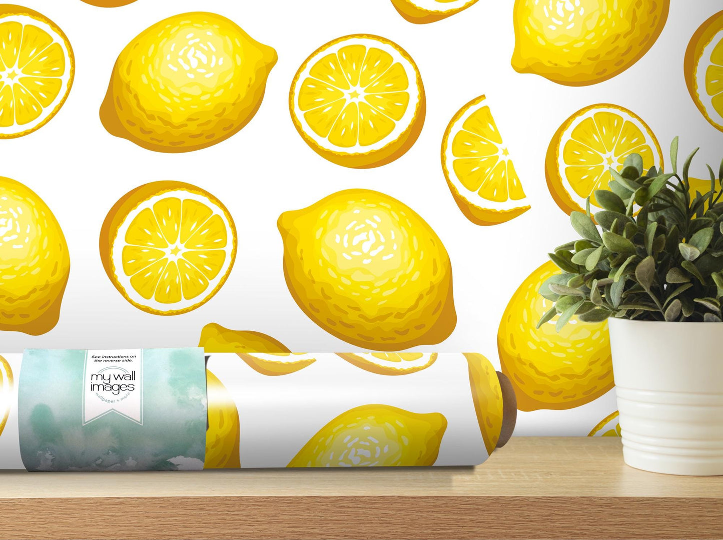 a vase with a plant next to a wallpaper with lemons on it