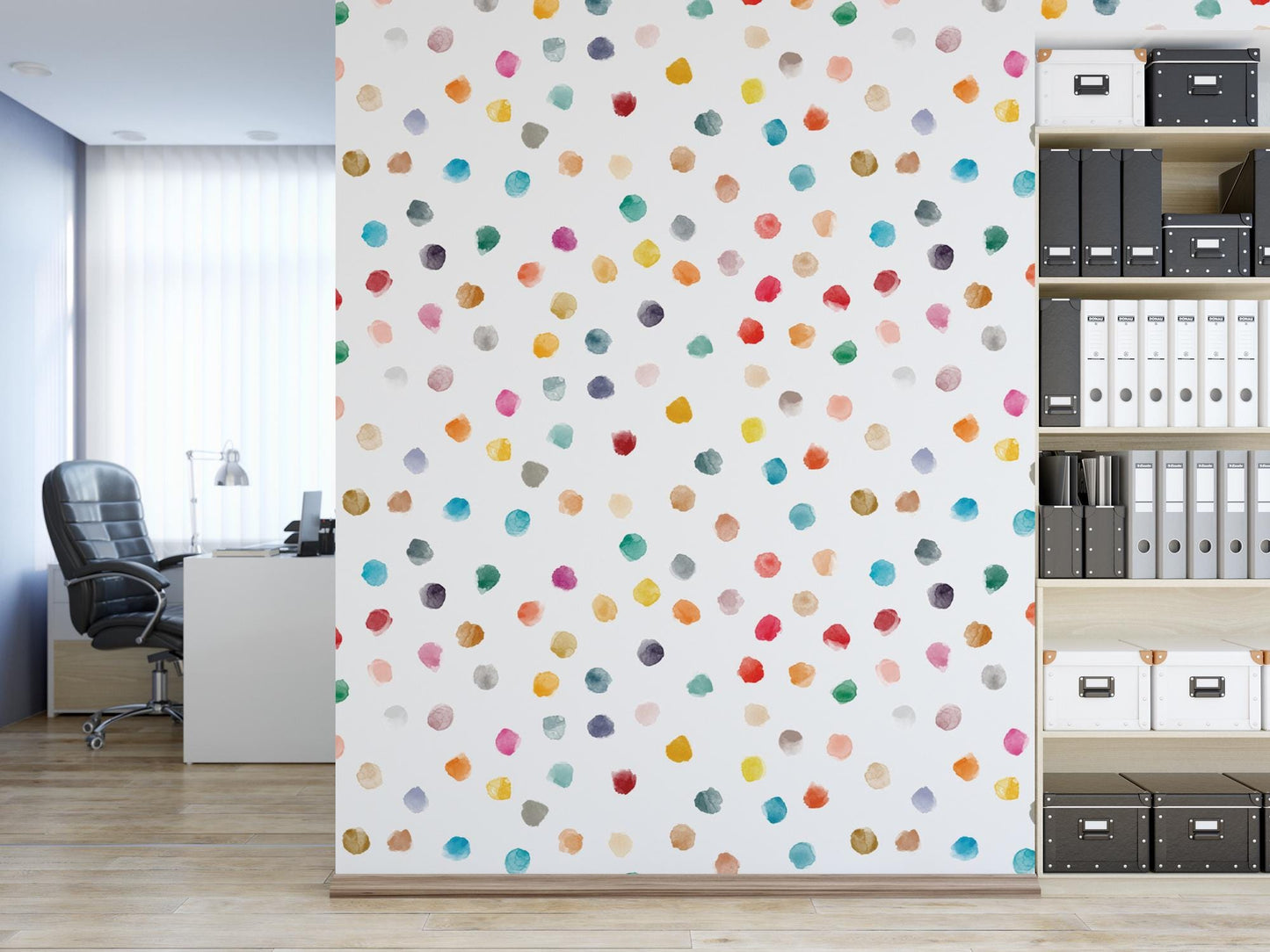 a room with a book shelf and a wall with a multicolored polka dot
