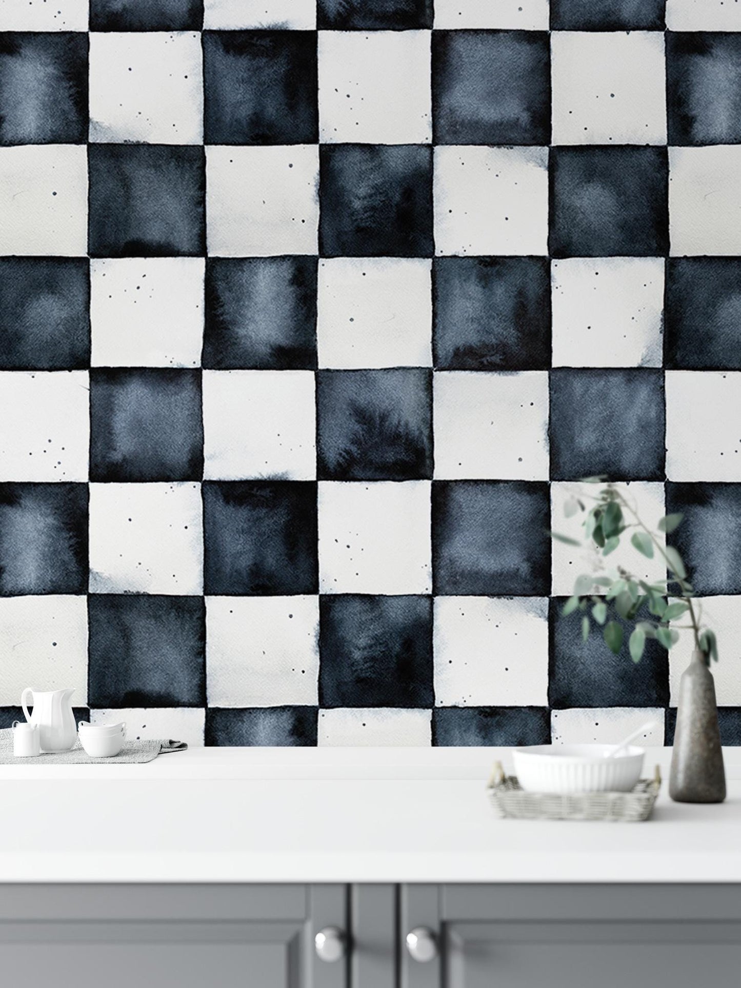 a black and white checkered wall with a vase of flowers