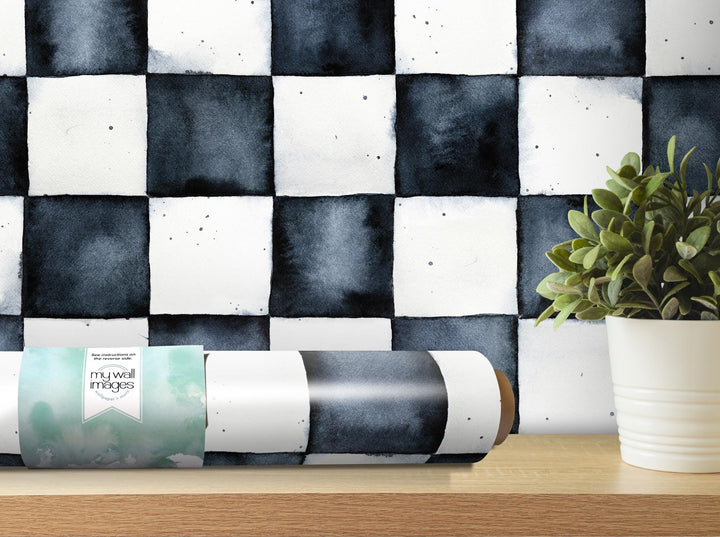 a black and white checkered wallpaper with a potted plant