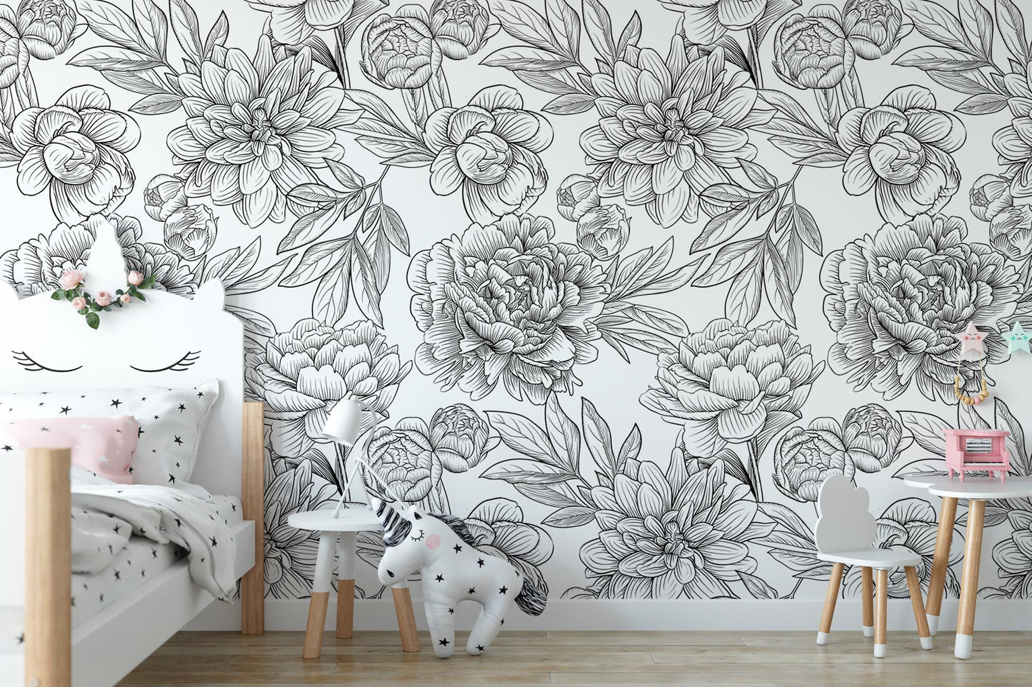 a child's room with a floral wallpaper