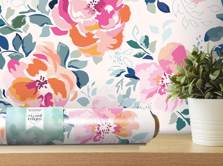 a flowered wallpaper with a vase of flowers next to it