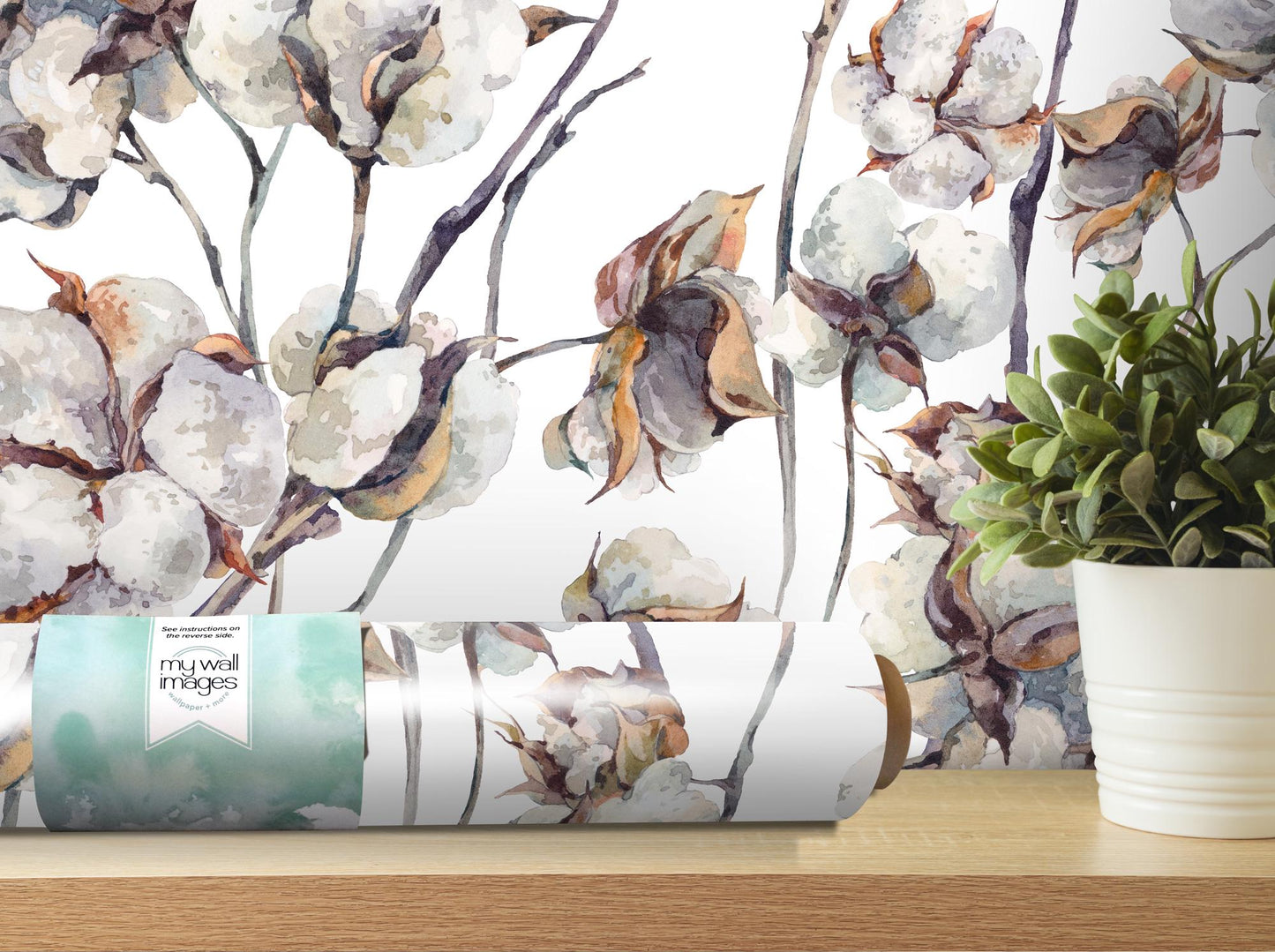 a vase of flowers sitting on top of a wooden table