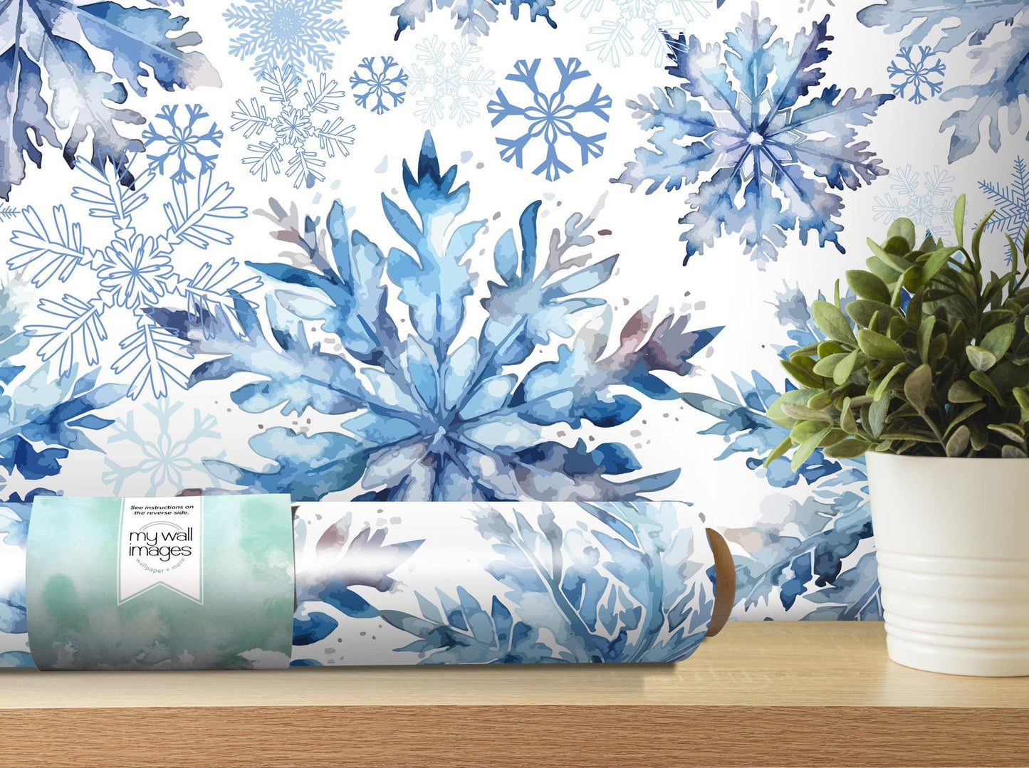 a blue and white wallpaper with snowflakes on it
