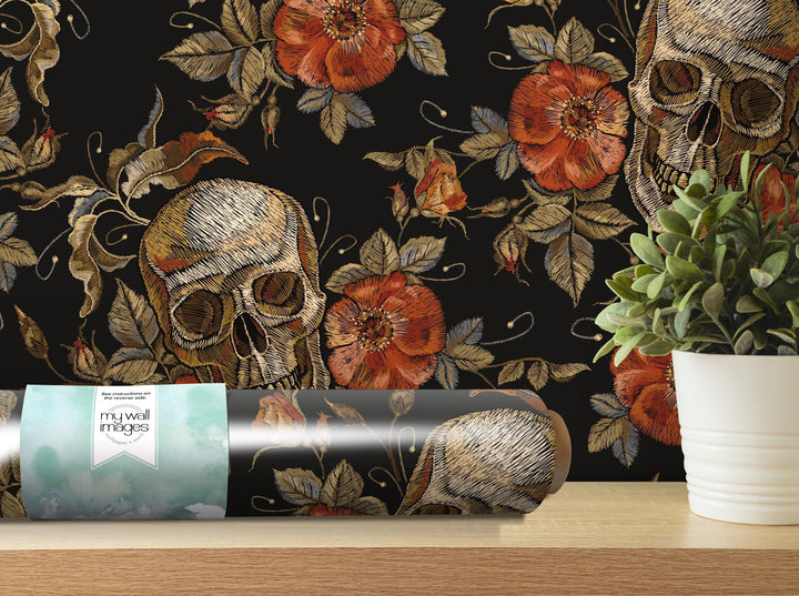 a vase with a flower and a skull on it