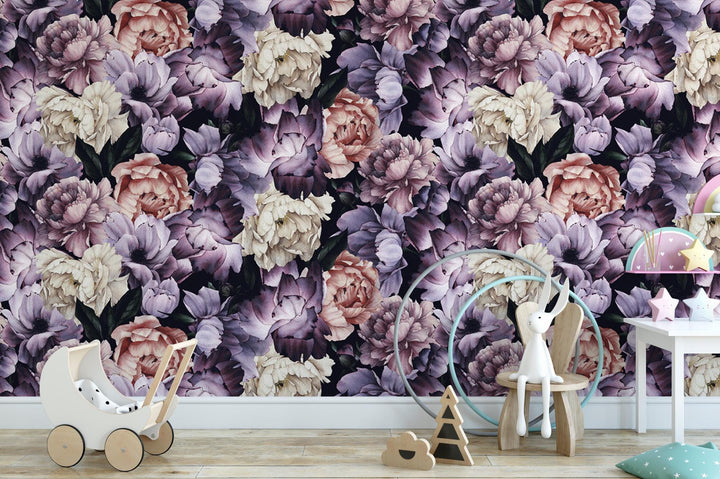 a baby's room with a floral wallpaper