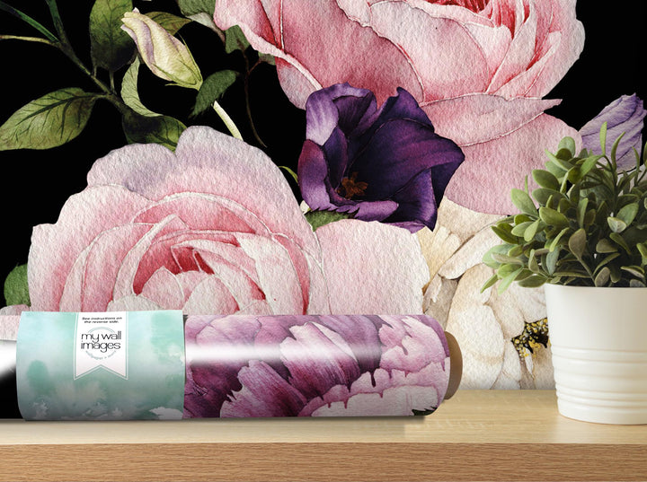 a vase of flowers sitting on a table next to a wallpaper