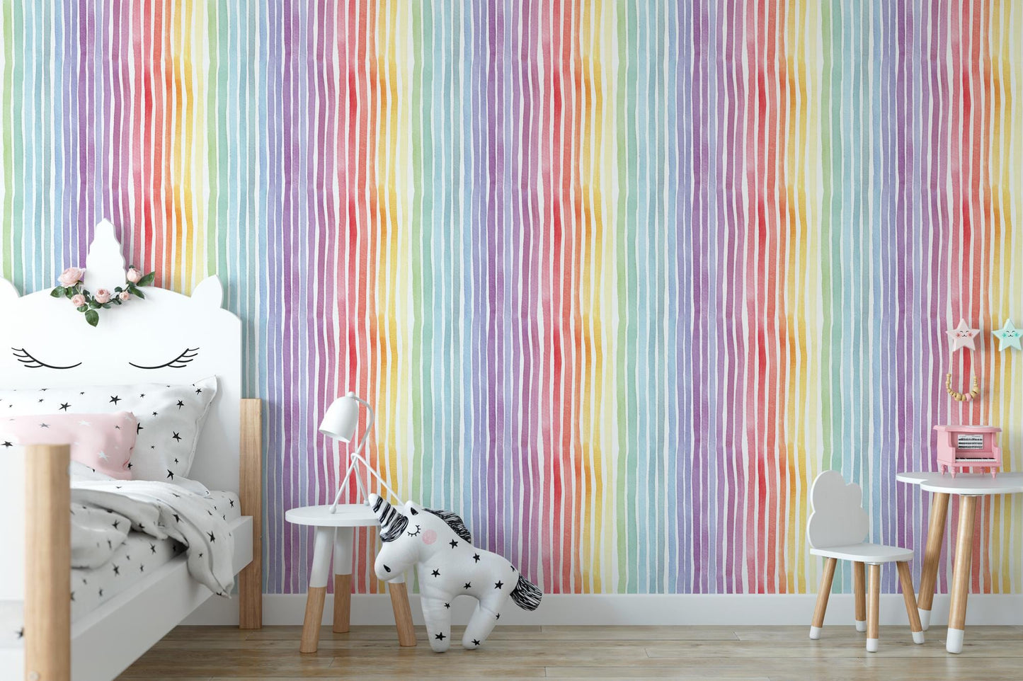 a child's bedroom with a rainbow striped wallpaper