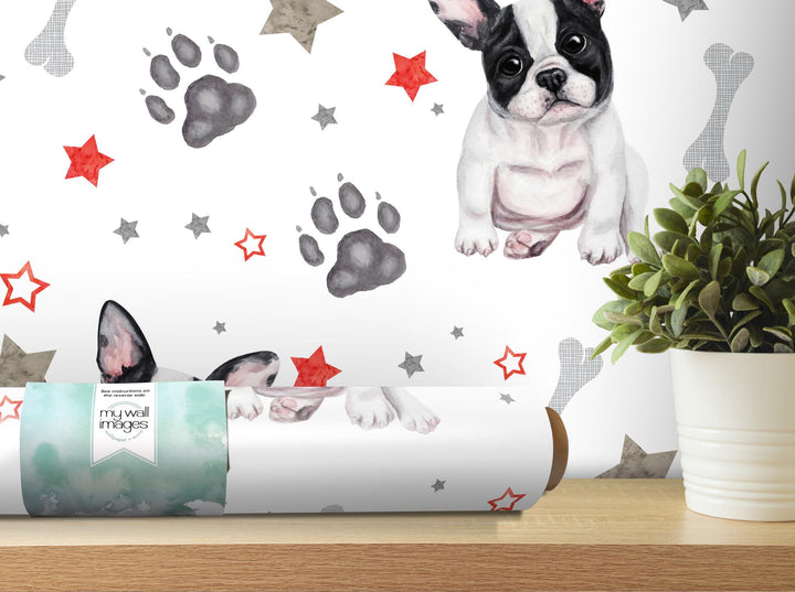 a picture of a dog on a wall next to a plant