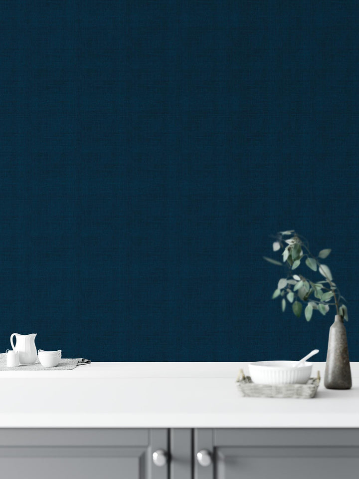 a white table with a vase of flowers on top of it