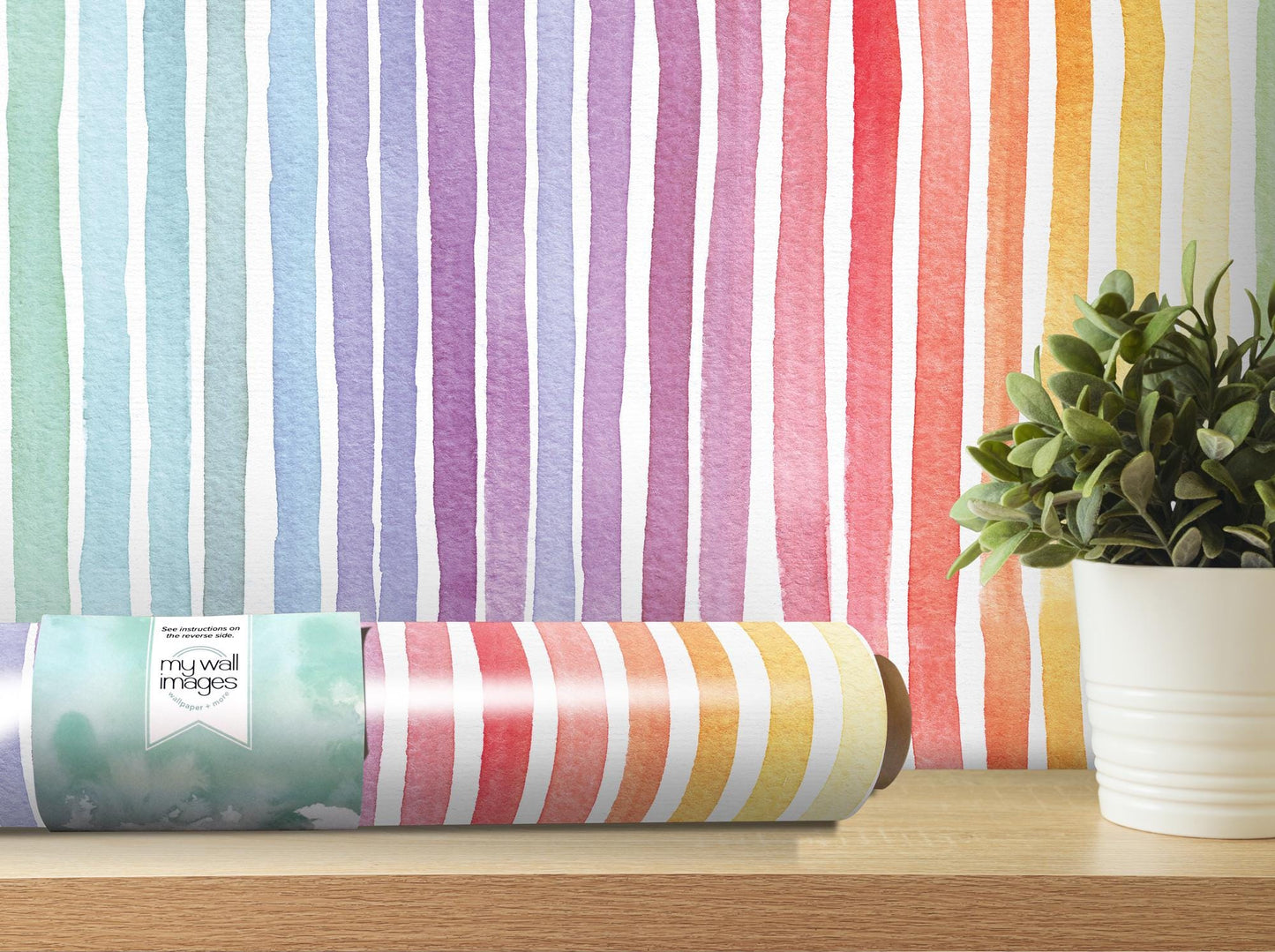 a potted plant sitting next to a roll of wrapping paper