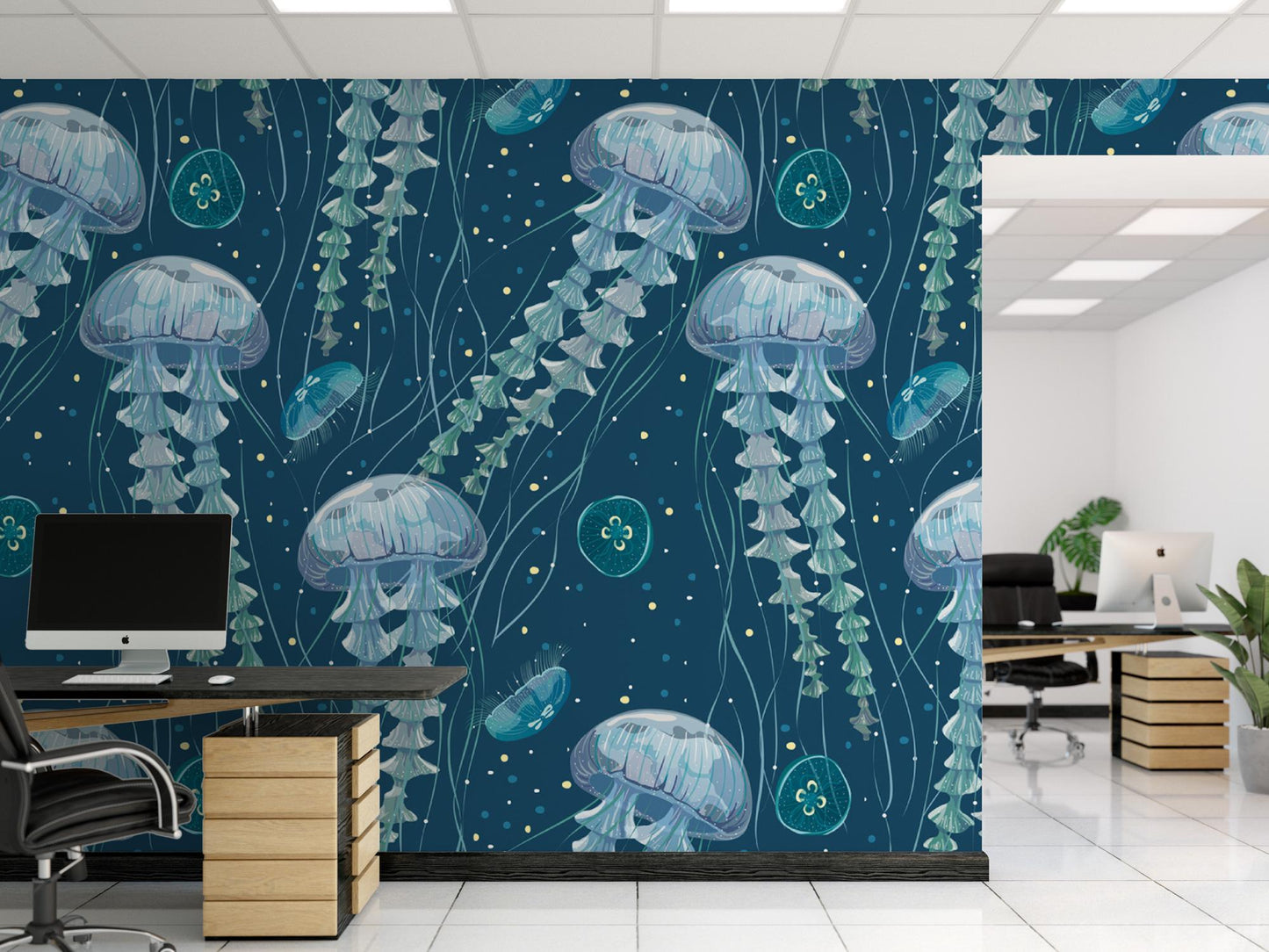 a room with a desk, chair, computer and a wall mural of jellyfish