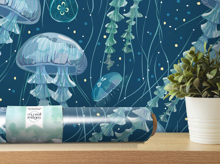 a blue wallpaper with jellyfish and a potted plant