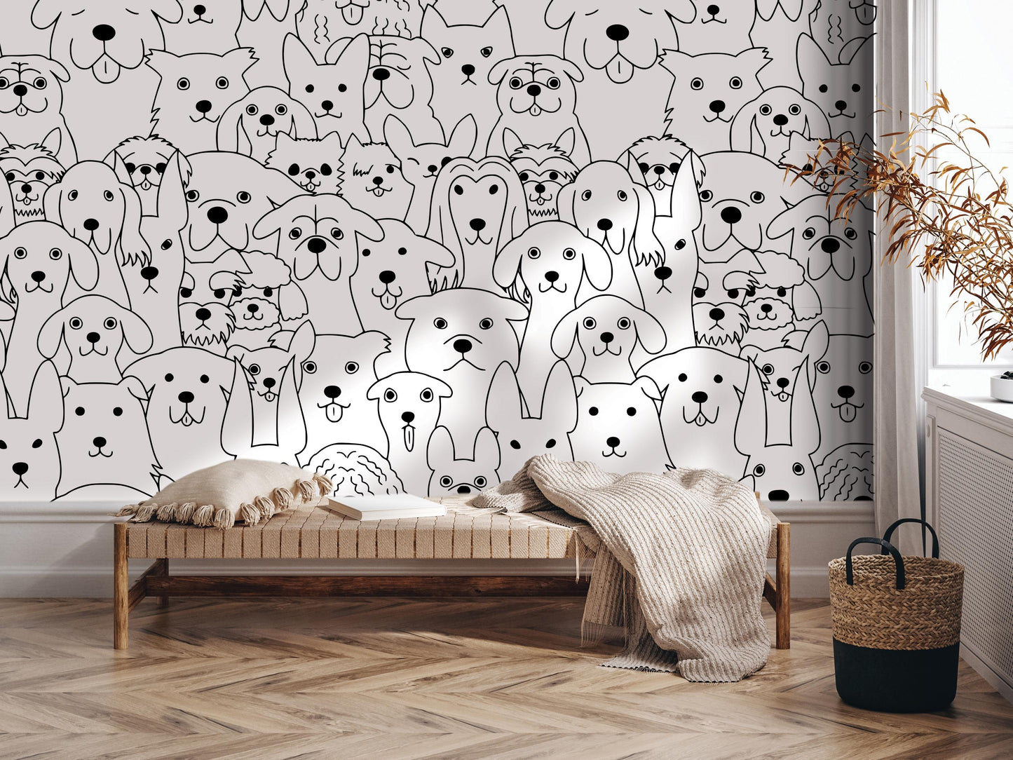a wall mural with a large number of stylized dog faces, creating a playful and whimsical atmosphere. In the foreground, there is a bench with a blanket draped over it, and a woven basket is placed nearby. The overall scene appears to be a cozy and inviting space, with the wall mural serving as a focal point and adding a touch of whimsy to the room.