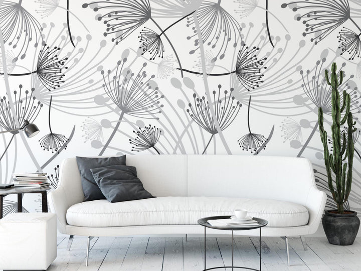 a white couch sitting next to a white table