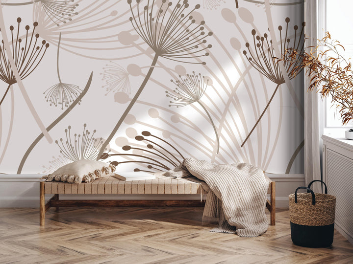 a modern and minimalist interior design with a large wall mural depicting abstract floral patterns in shades of brown and beige. The room includes a wooden bench with a blanket draped over it, a woven basket, and a potted plant, creating a cozy and inviting atmosphere.