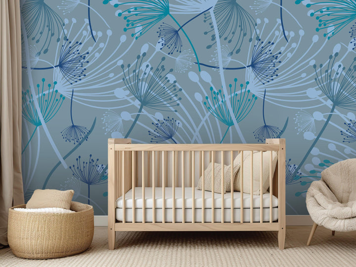a nursery room with a wooden crib, a woven basket, and a beige chair. The walls are decorated with a blue and white floral pattern, creating a calming and soothing atmosphere.