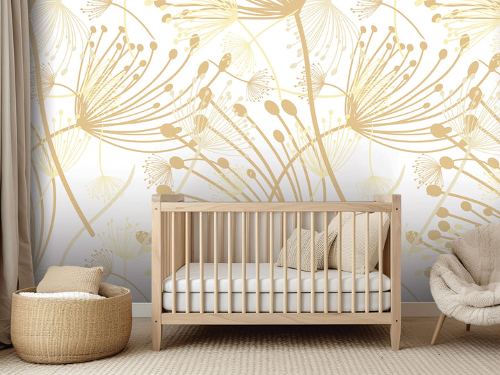 a nursery room with a wooden crib, a woven basket, and a plush chair. The room has a white and gold floral wallpaper with a repeating pattern of dandelions and flowers.