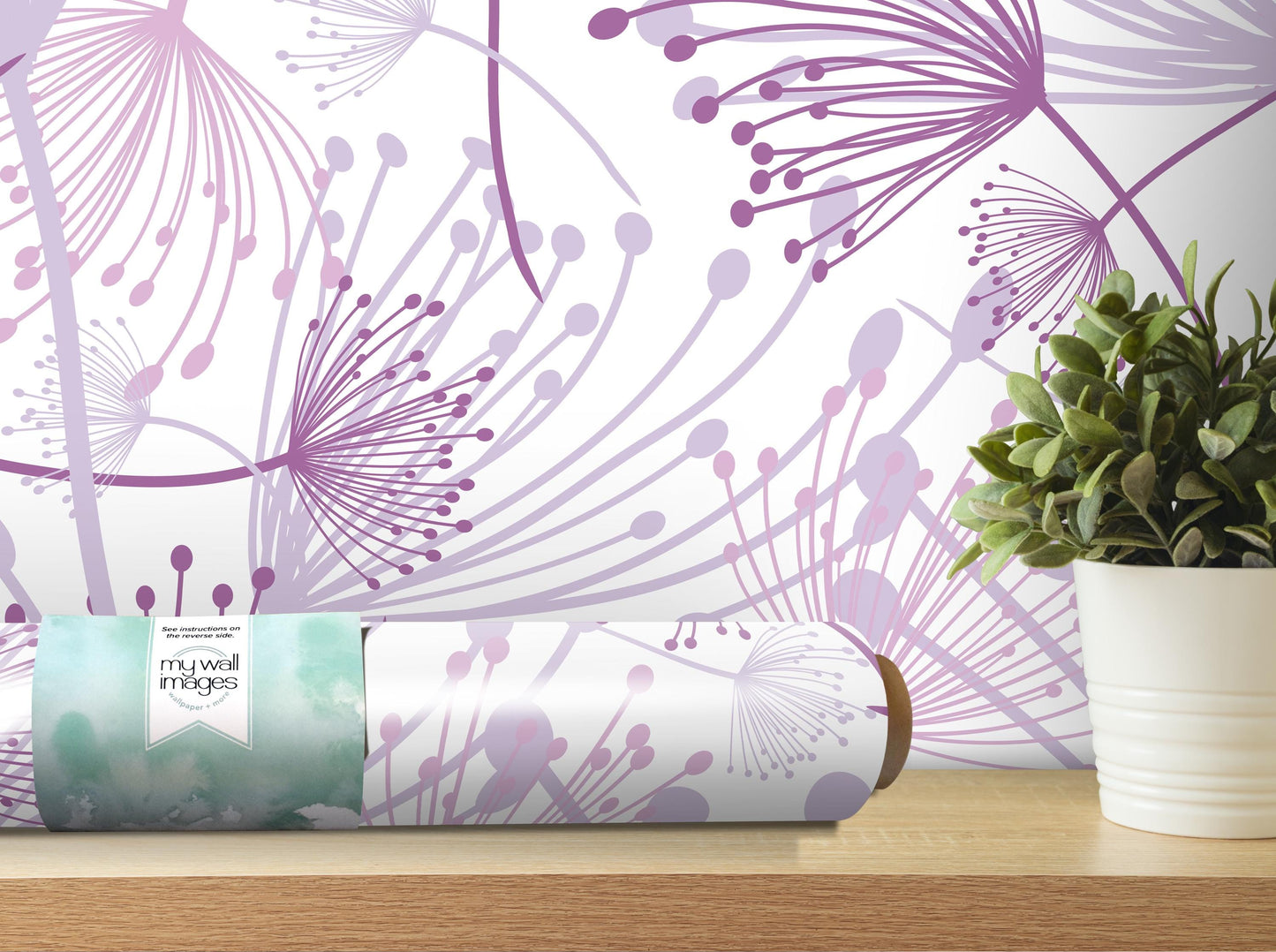 a wallpapered wall with a purple and white floral pattern, a potted plant, and a roll of wallpaper on a shelf.