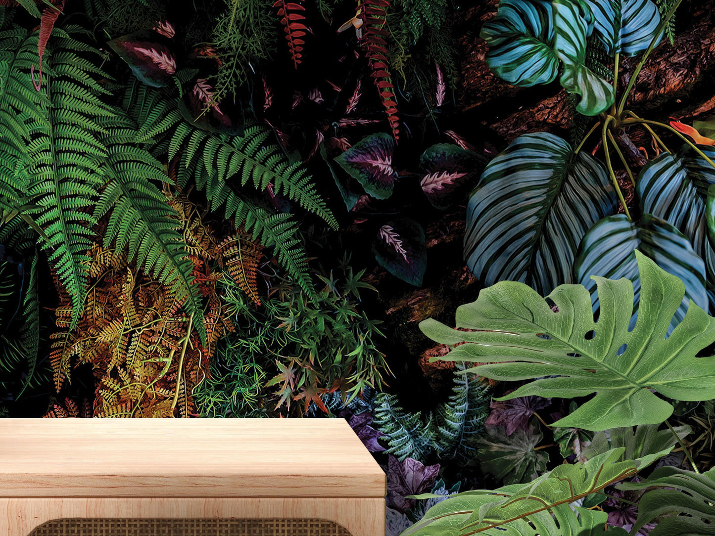 The image is a vibrant and lush display of tropical foliage, including ferns, palm leaves, and other exotic plants, creating a dense and dense jungle-like atmosphere.