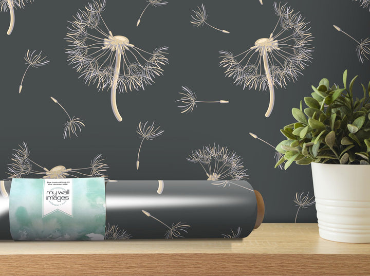 a vase with a plant next to it on a table