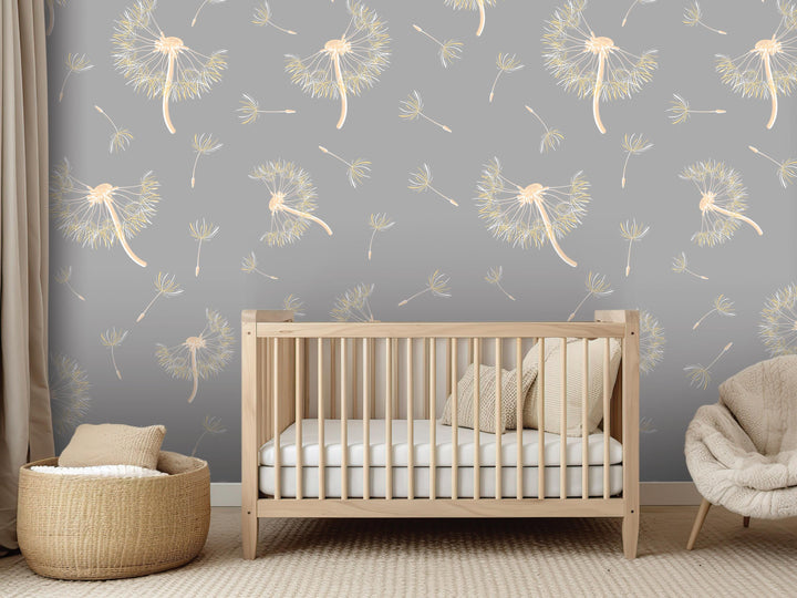 a nursery room with a wooden crib, a woven basket, and a plush chair. The walls are covered in a gray and white pattern featuring dandelions and other floral designs.