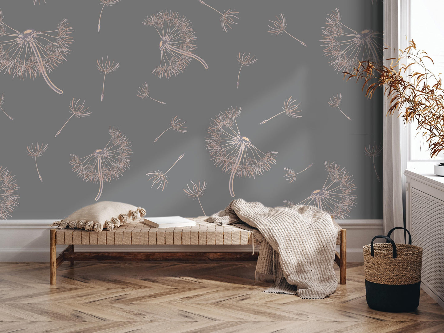 a cozy and inviting living space with a wooden bench, a woven basket, and a decorative wall with a repeating pattern of dandelion-like designs in shades of gray and beige.