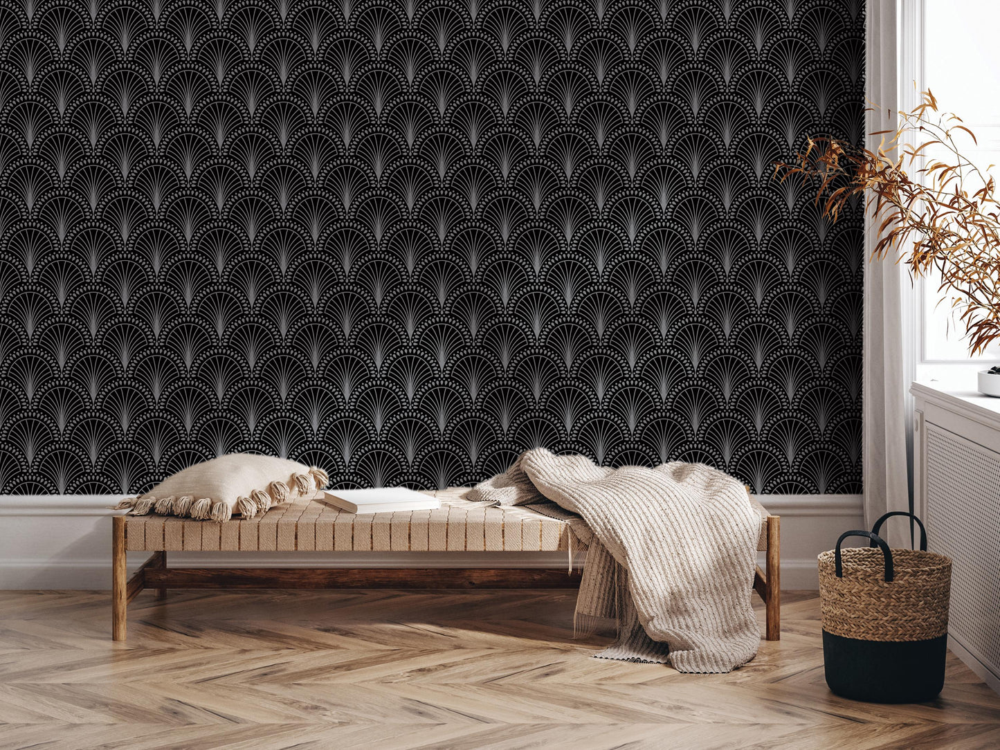 a modern and stylish interior design with a black and white patterned wallpaper, a wooden bench with a white pillow, and a woven basket on the floor.
