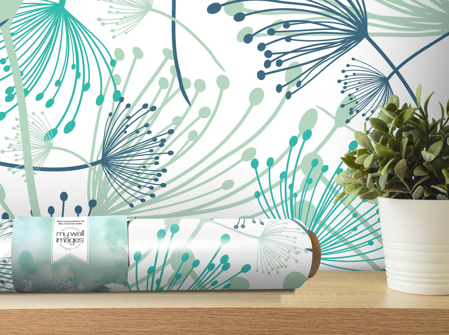 a wallpapered wall with a floral pattern, a potted plant, and a roll of wallpaper on a shelf.