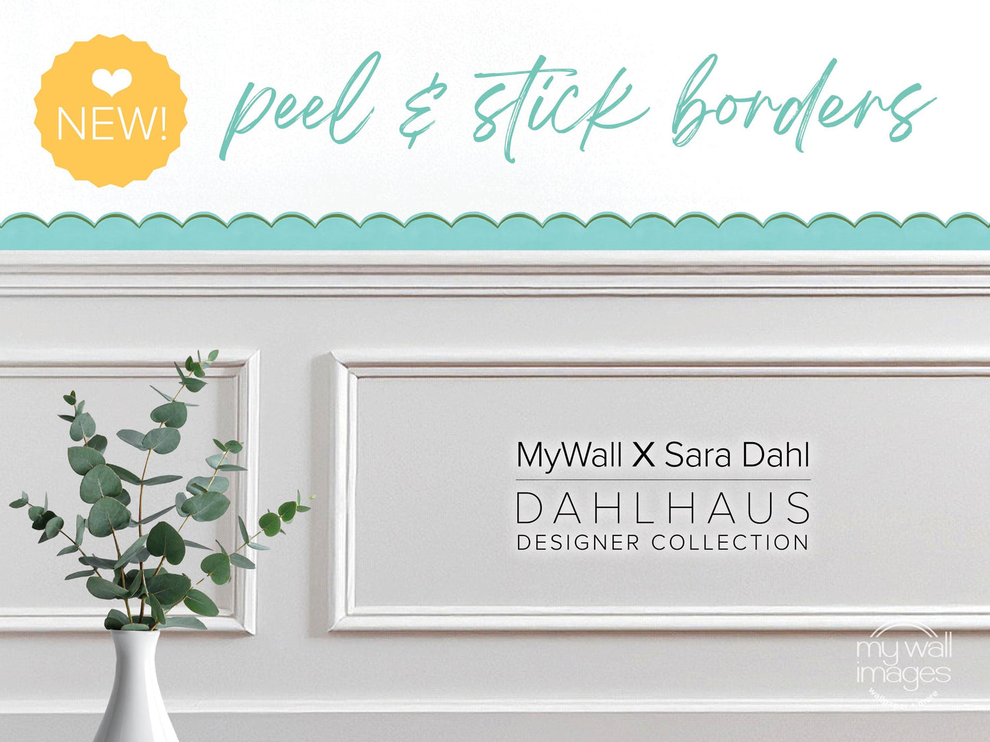 a white wall with a framed picture of a plant, and there is text that reads "MyWall x Sara Dahl Dahlhaus Designer Collection" and "NEW!" in the top left corner.