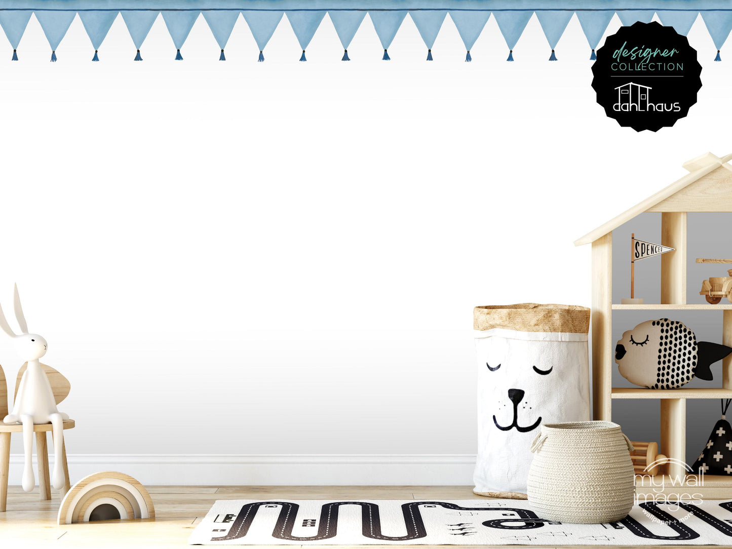 A child's bedroom with a wooden playhouse, a stuffed animal rabbit, and a basket with a face on it. The room has a white color scheme and features a patterned rug on the floor.
