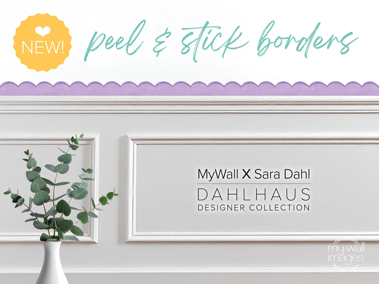 a white wall with a framed picture of a plant, and there is a yellow heart sticker on the wall.