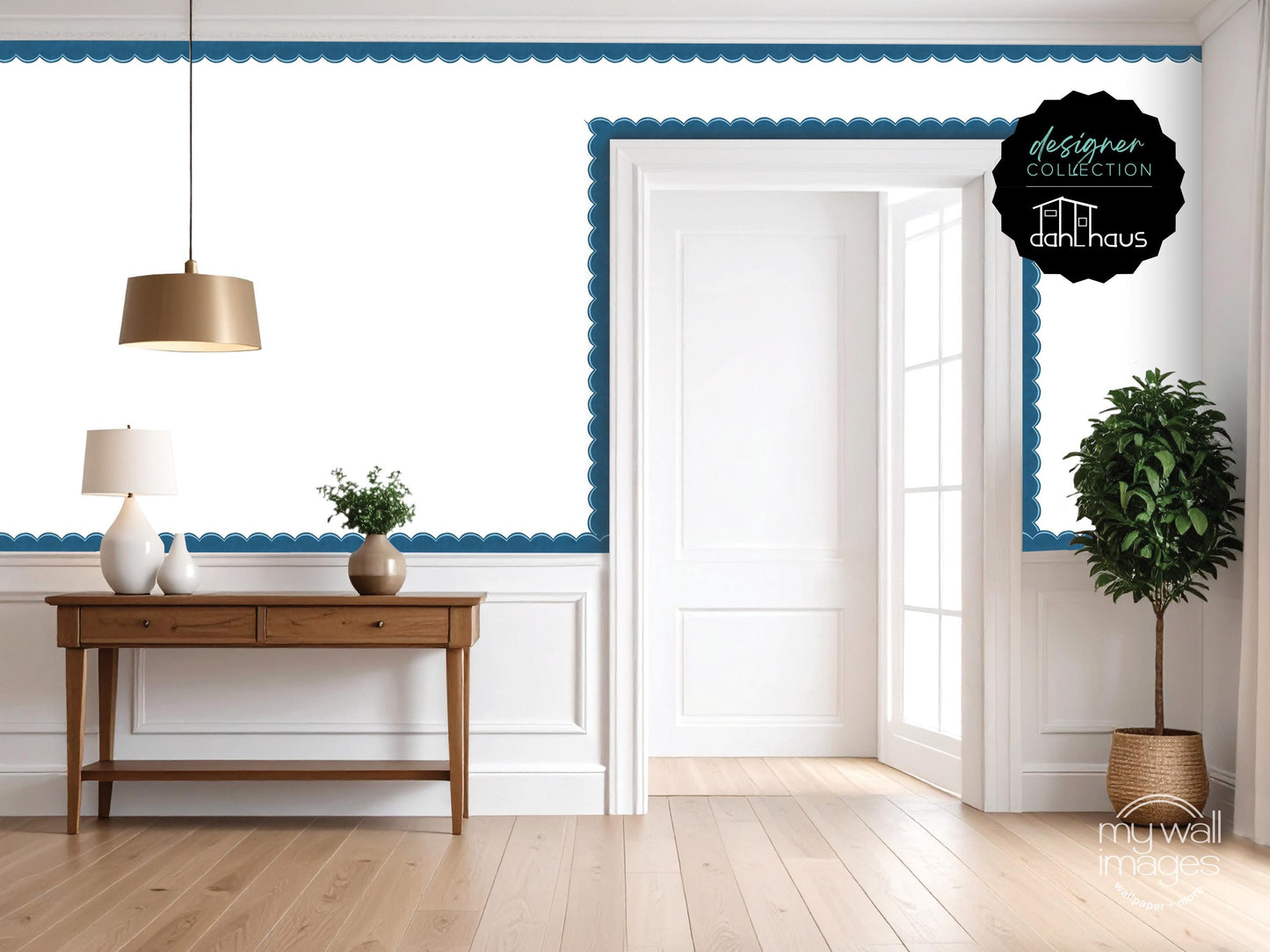 a modern and minimalist living room with a wooden console table, a lamp, and a potted plant. The room has white walls and a blue scalloped trim, creating a clean and elegant atmosphere.