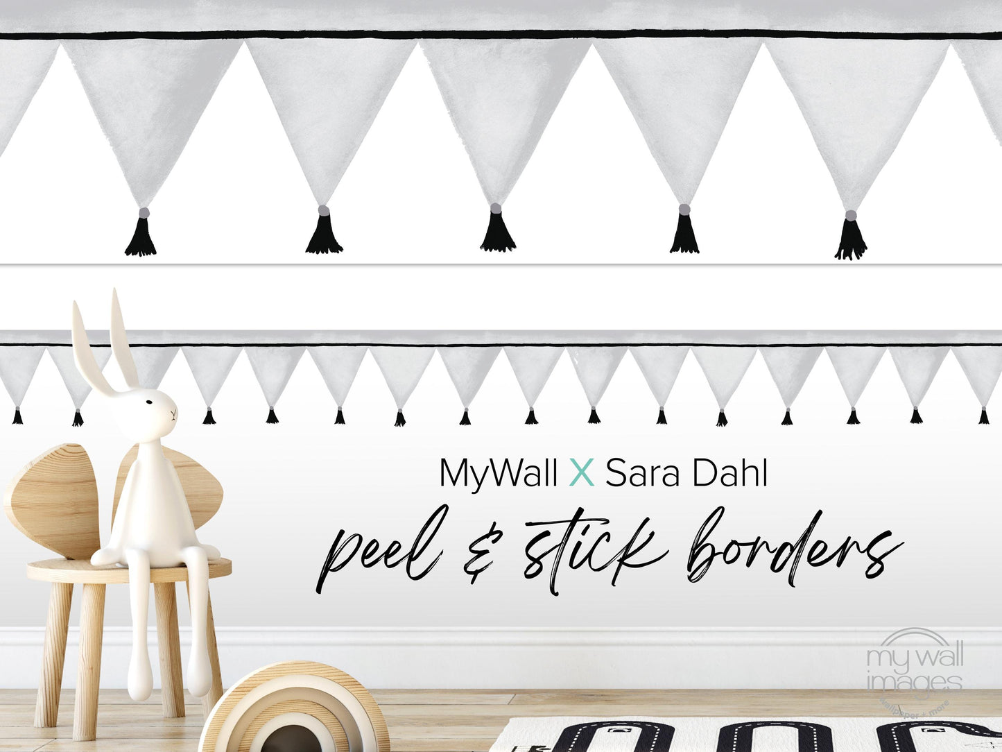 a white rabbit sitting on a wooden chair, with a wall decorated with black and white tassels above it. The wall also has a text overlay that reads "MyWall X Sara Dahl peel & stick borders".