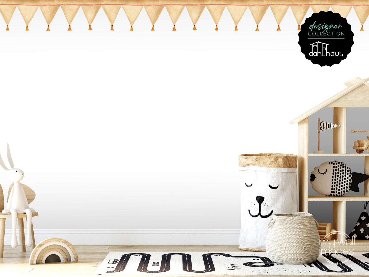 A child's bedroom with a white wall, a wooden shelf with a toy house, and various toys and decorative items.