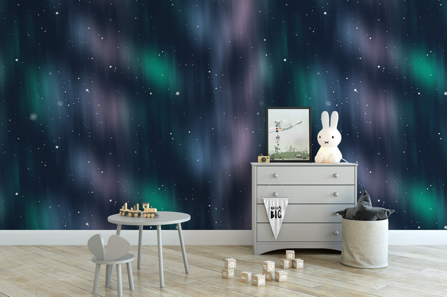 a cozy nursery room with a wooden floor, a white dresser, a small table with a toy train, a stuffed bunny, and a toy castle. The walls are adorned with a starry night sky wallpaper, creating a whimsical and enchanting atmosphere.