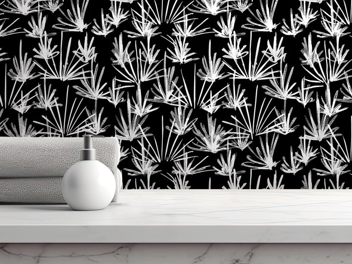 a white bottle on a white countertop, with a black and white patterned wallpaper in the background.