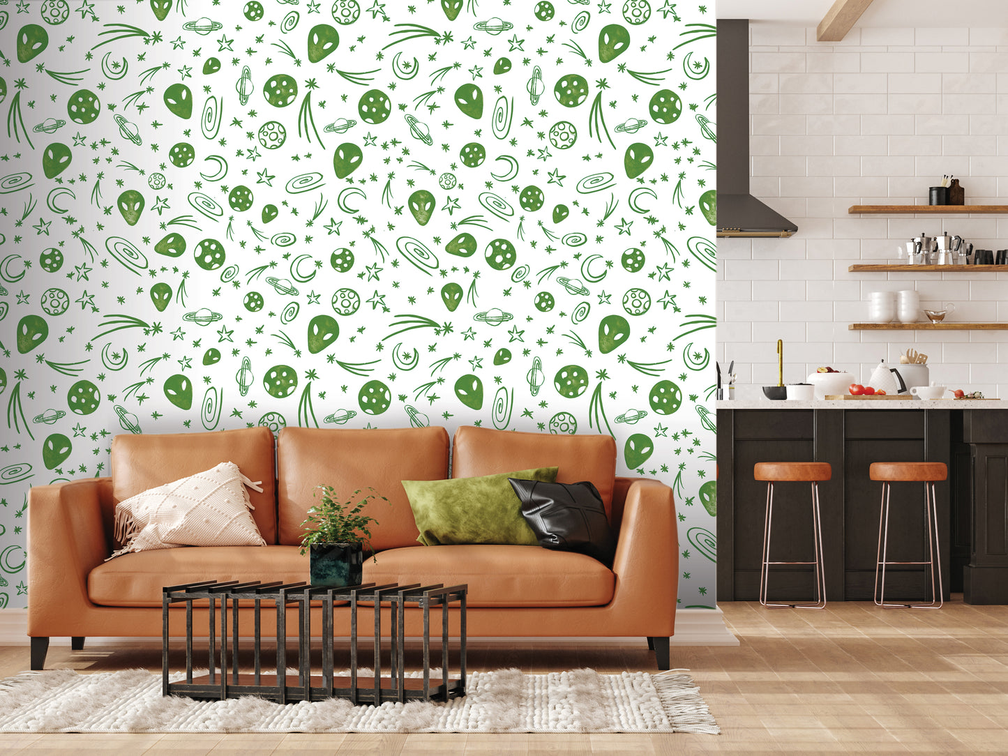 a modern living room with a brown leather sofa, a black coffee table, and a kitchen area with a counter and stools. The wall behind the sofa is decorated with a pattern of green and white stars and other celestial objects, creating a whimsical and celestial atmosphere.