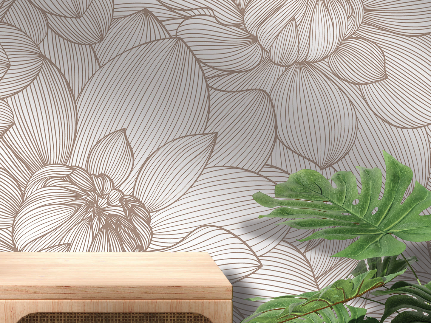 a wall with a floral pattern and a wooden table in the foreground.