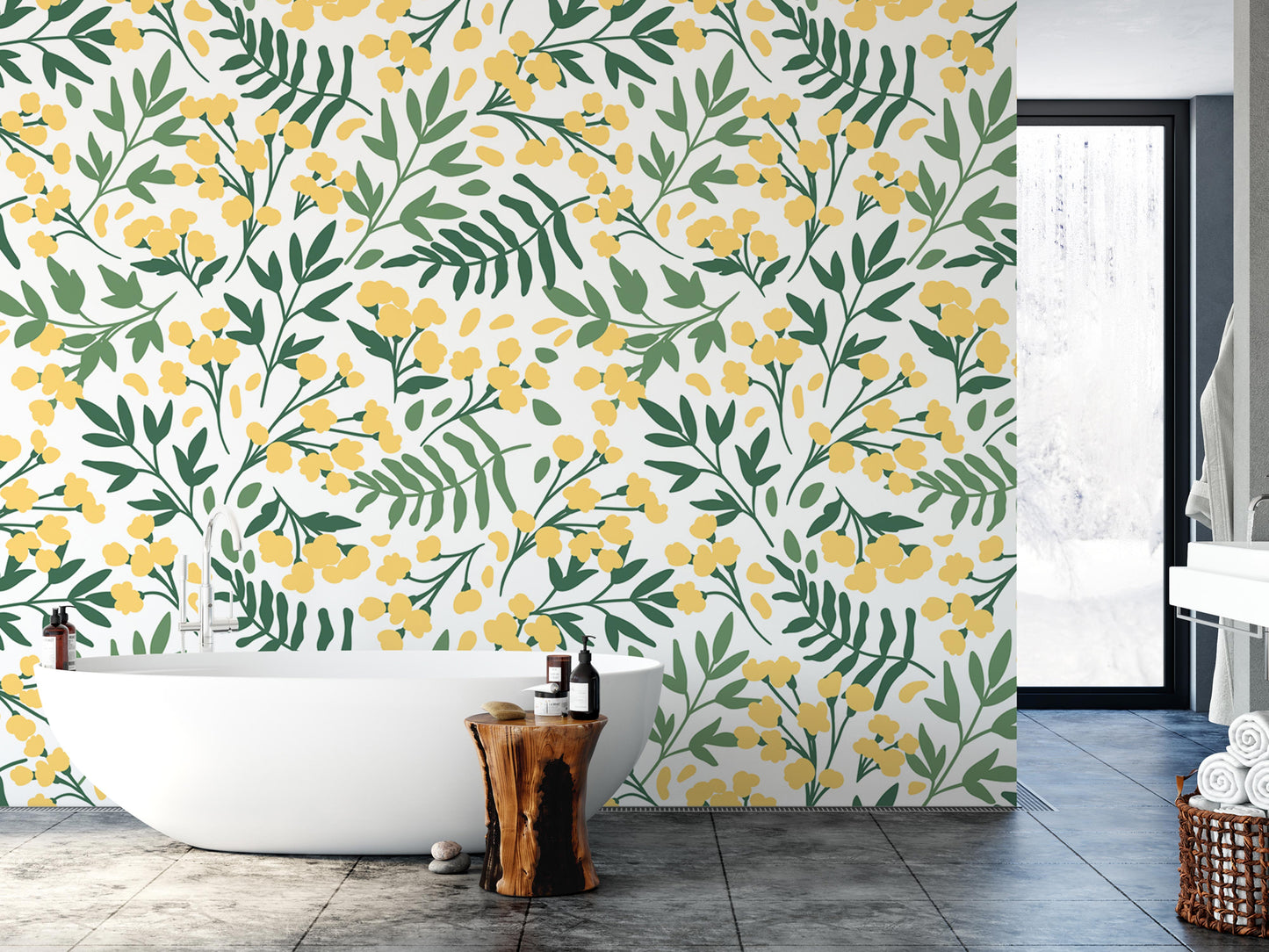 a bathroom with a white freestanding bathtub, a wooden stool, and a large wall with a floral pattern in shades of yellow and green.