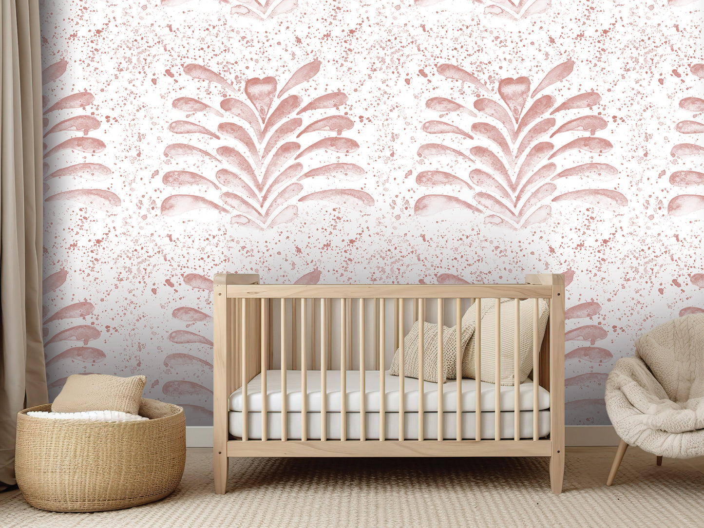 a nursery room with a wooden crib, a woven basket, and a plush chair. The room has a pink and white color scheme, with a patterned wallpaper featuring a stylized plant design.